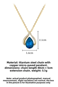 Macro shot of blue waterdrop pendant necklace with titanium steel chain and crystal details
