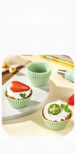 Food-grade silicone muffin cups with wavy edges showing heat resistance up to 230 degrees