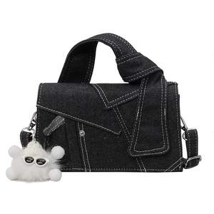 Black denim crossbody bag with contrast stitching and cloud plush charm detail