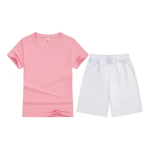 Flat lay of kids pink cotton T-shirt and white shorts set showing size 130 tag detail