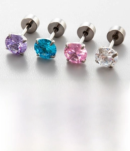 Detail of titanium steel stud earrings with purple, teal, pink, and clear zircons