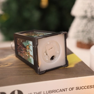 Macro shot of the Christmas lantern base featuring the power switch and battery compartment