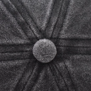 Detailed top view of charcoal grey baseball cap showing center button and quality stitching