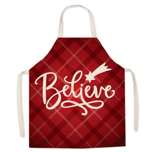 Deep red plaid Christmas apron with white Believe text and star print on white background