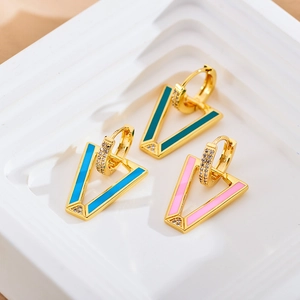 Detailed view of gold V-shaped earrings in pink, sky blue and dark green enamel with zircons