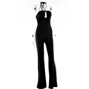 Detail of backless halter jumpsuit in black with cutout design and high waist