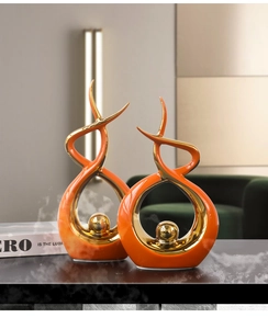 Modern abstract ceramic sculptures in orange and gold for home and office decor