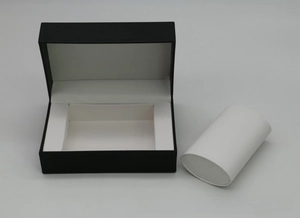 Detail of premium PU leather watch box with white cylinder cushion and flip lid