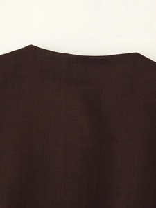 Detailed macro view of dark brown fabric texture on a sleeveless cowl neck top