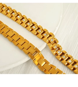 Macro detail of 18k gold plated watch link bracelets with and without cubic zirconia