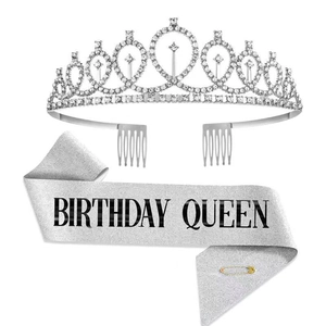 Detailed set of a sparkling silver rhinestone crown and a Birthday Queen sash with a pin