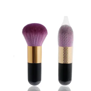 Macro view of portable powder brush with synthetic bristles and protective mesh cover