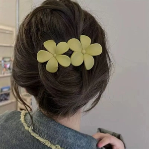 Matte yellow double flower hair clip hair accessory for women on model back view