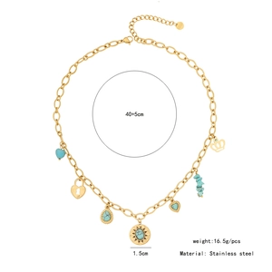 Detail view of gold stainless steel necklace with turquoise charms, heart and crown charms