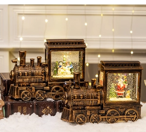 Close-up of vintage Christmas train lantern with Santa scene and warm LED glowing light