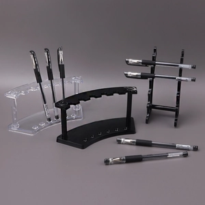 Clear acrylic and black plastic pen display stands for office and cosmetic storage