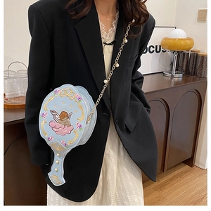 Detailed embroidery of angel and floral patterns on blue unique hand-mirror shape bag