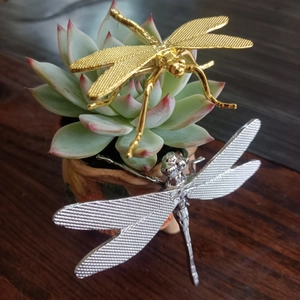Set of gold and silver dragonfly figurines used as tea pet or succulent decor
