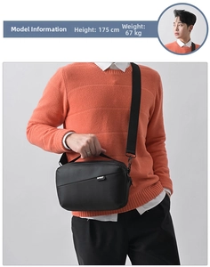 Close-up of waterproof fabric men's crossbody bag featuring Sport label and adjustable strap