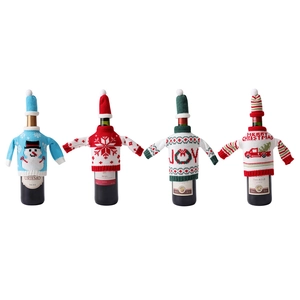 Set of 4 Christmas wine bottle covers with knitted sweaters and mini hats in festive designs