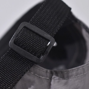 Close-up of adjustable nylon strap and plastic buckle on cotton baseball cap back