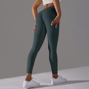 Detail of high-waist scrunch butt yoga leggings in dark charcoal with ruching effect