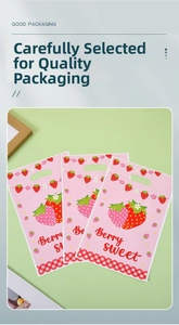 Detail of pink strawberry gift bags with Berry Sweet text and handle holes for parties