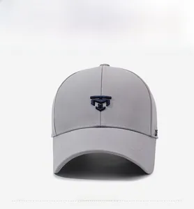 Detailed view of 3D navy blue embroidery on light grey six-panel baseball cap