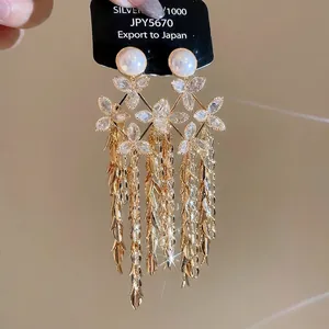 18K gold plated flower pearl tassel earrings with cubic zirconia and metallic leaves
