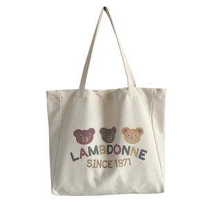 Large cream canvas tote bag featuring cute embroidered bears and vintage text design