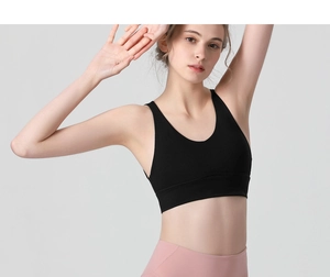 Detail of high-impact black sports bra with deep V-neck and wide support band