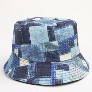 Detail of vintage 90s reversible bucket hat with blue denim floral patchwork patterns