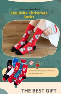 Detail view of 4-pack Christmas cotton socks featuring Santa Claus and reindeer patterns