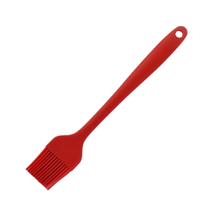Single piece red silicone basting brush with ergonomic handle for baking and barbecue