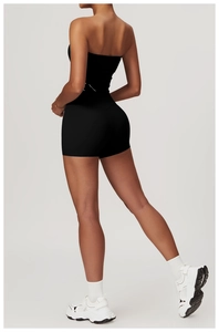 Detail view of black seamless yoga set showing high-waist shorts and open back sports bra
