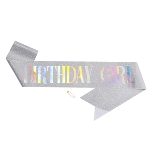 Silver glitter Birthday Girl sash with holographic lettering and a gold safety pin