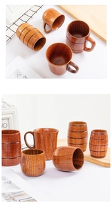 Detailed view of various natural wood cups including beer mugs and mugs with handles
