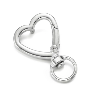 Detail of silver heart-shaped lobster clasp with 360-degree rotating swivel ring