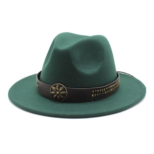 Detail of dark green wool fedora featuring brown leather band and antique brass floral buckle