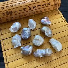 Macro detail of natural baroque stick pearls with high luster on a bamboo mat background
