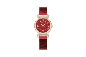 Close-up of sparkling starburst red dial and golden rhinestone watch case details