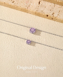 Detailed view of S925 sterling silver lavender rose cut crystal necklaces on stone