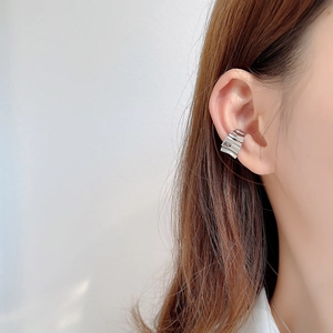 925 silver wavy ear cuff earring with gear-inspired minimalist industrial design on model