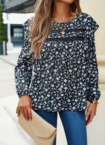 Detail of floral long sleeve blouse with black lace trim and ruffled shoulder accents