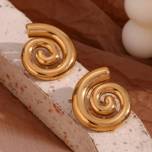 Detail of 18K gold-plated peanut-shaped earrings on a textured stone display