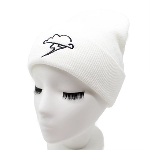 White knitted beanie with black lightning cloud embroidery displayed on a model head