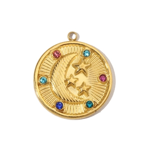 Detailed macro view of gold-plated celestial pendant with moon and colorful gemstones