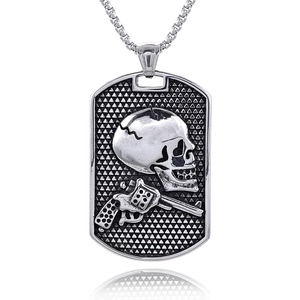 Detailed macro of vintage silver skull and revolver pistol relief on a steel military dog tag