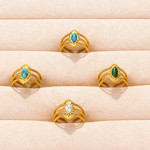 Set of four 304 stainless steel gold rings with colorful oval stones in a jewelry box