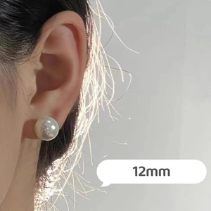 Detailed view of 12mm white pearl stud earring on model with elegant glossy finish